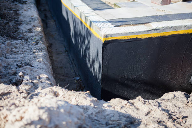 Professional Basement Waterproofing technician working in Oregon City, OR